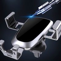 Gravitacinis automobilio išmaniojo telefono laikiklis, juodos spalvos, tvirtinamas prie oro ventiliacijos grotelių